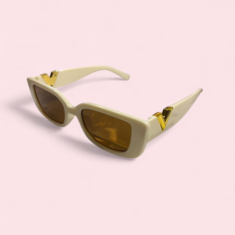 Cream sunglasses with gold accents